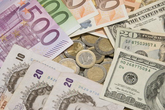 Money. World currencies: U.S. dollars, pounds and euros.