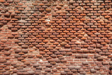 Old weathered brick wall as texture.