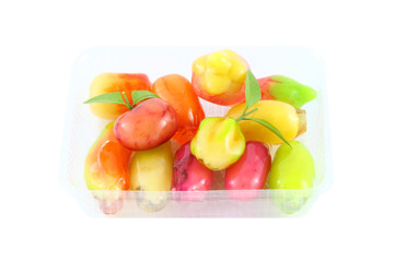 Deletable imitation fruits dessert on plastic package.