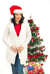 Attractive woman with Christmas tree