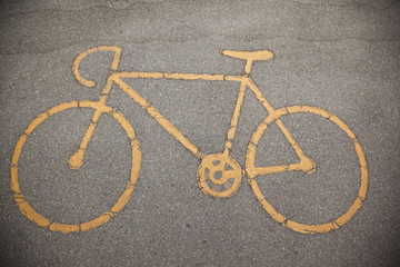 Fototapeta na wymiar sign a bicycle path on the pavement