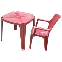 Red plastic table and chair isolated