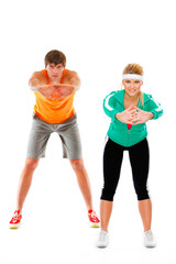 Fototapeta premium Fit young woman and man in sportswear making sport exercise