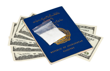 Fototapeta premium Package with drug over the Afghan passport and U.S. dollars