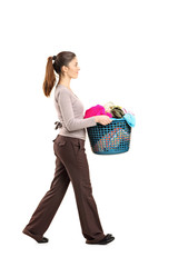 Full length portrait of a female holding a laundry basket