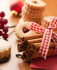 Cinnamon sticks with some cookies and berries