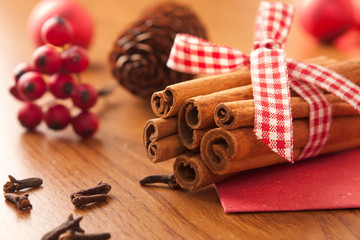 Cinnamon sticks with Christmas ornaments