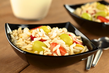 Puffed rice cereal with strawberries, bananas, grapes