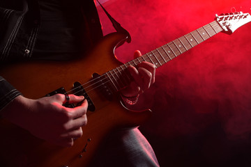 Obraz na płótnie Canvas rock guitarist playing at a live concert