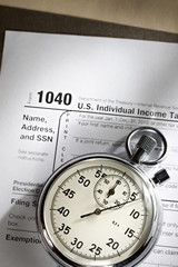 Tax form and stopwatch