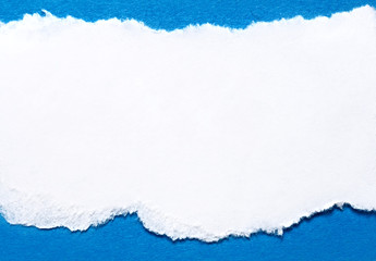 A piece of paper on blue