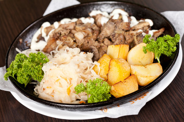 meat with potatoes in the pot