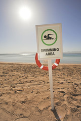 Swimming sign on a tropical beach