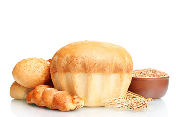 delicious round bread, buns and wheat isolated on white