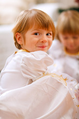 Fototapeta premium Portrait of happy girl playing with sister