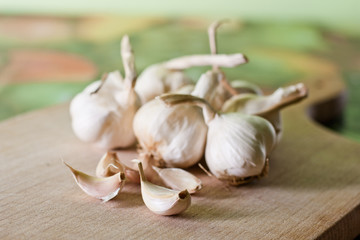 Garlic on the kitchen wooden board