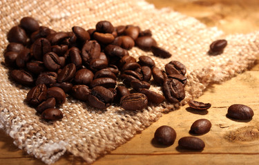 coffee beans on sacking on wooden table