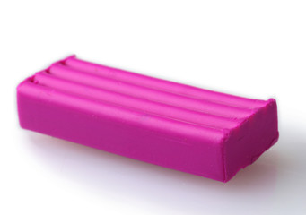Children bright pink plasticine isolated on white