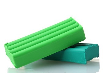 Children bright green plasticine isolated on white