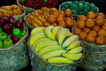 variety of fruit in bamboo basket .