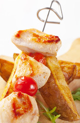 Chicken skewer and potato wedges
