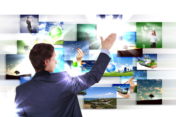 Man working with vurtial screens