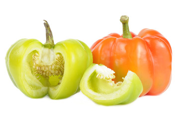 Red and Cut Green Bell Peppers Isolated on White Background