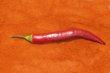 Naklejka premium chilis on ground pepper