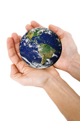 Human hands holding planet Earth