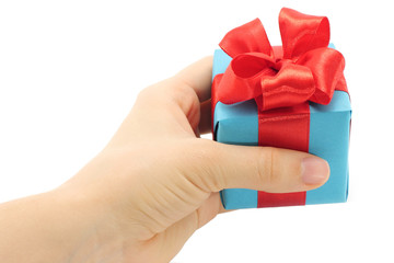Hand holds present box on a white background