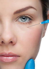 Cosmetic injection near woman's eye