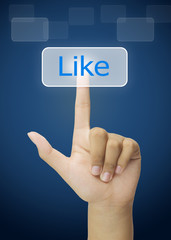 Hand pressing Like button on touchscreen