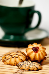 cookies on a napkin against a green cup