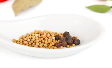 seed mustard in spoon isolated on white background