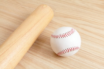 Baseball and bat with wood background