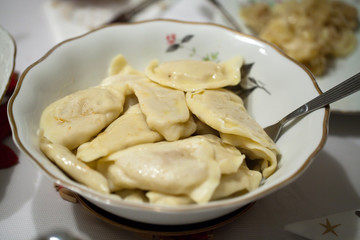 Dumplings filled cheese, cabbage and potatoes adorned bacon