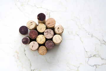 Various wine corks on a marble table, free copy space