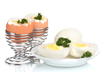 tasty boiled eggs and parsley isolated on white