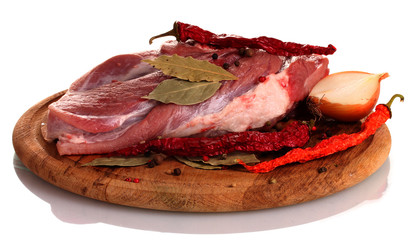 Obraz premium Raw meat and vegetables on a wooden board isolated on whitе
