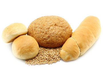 Bread and buns with wheat on a white background