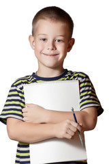 smiling boy holding paper blank