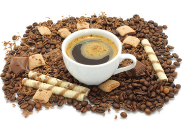 Cup of coffee with chocolates close-up