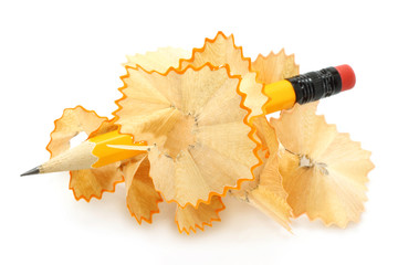 Pencil in wood shavings on a white background