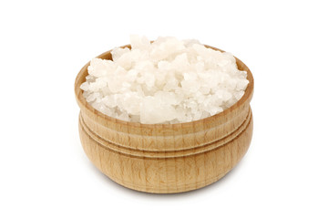 Sea salt in a wooden tableware close-up