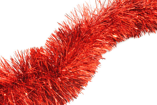 Red Tinsel Close-up On White Background