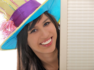 smiling girl with a fancy hat