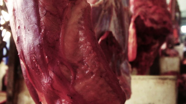 Cut lamb hanging for sale in wet market