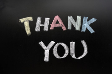 Thank you - text written with chalk on blackboard