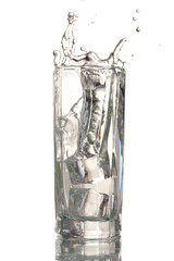 fresh water in glass with ice cubes isolated on white