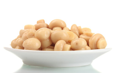Marinated mushrooms in white saucer isolated on white